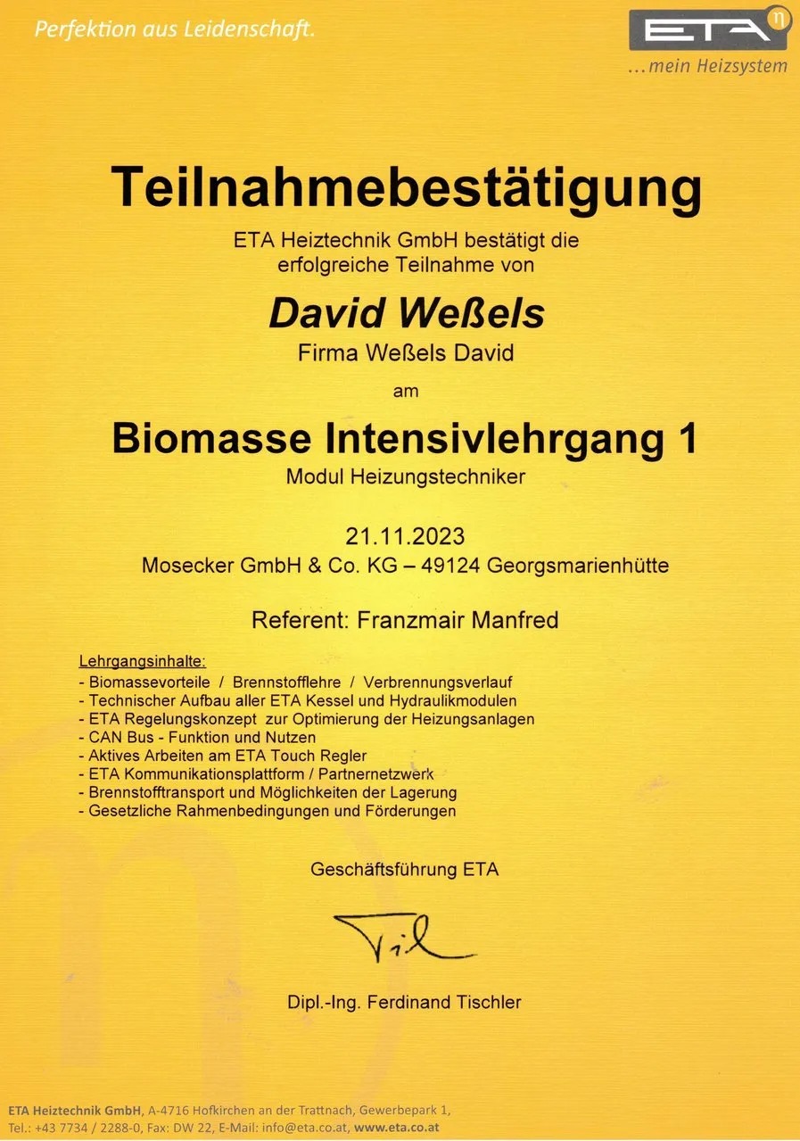 David Wessels lächelt leicht auf einer Urkunde mit gelbem ETA Logo und schwarzen Texten